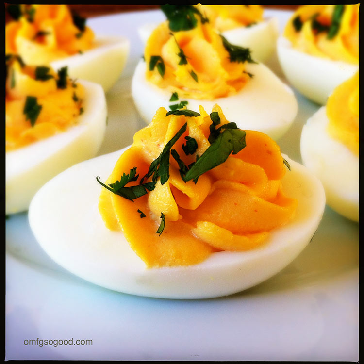 http://omfgsogood.com/2013/03/20/sriracha-deviled-eggs/